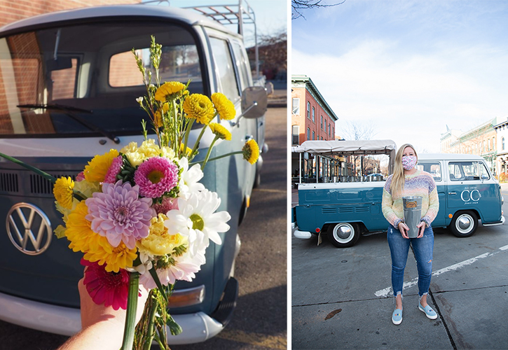 owner of CCs flower truck holding up a bouquet of flower in front of trucks