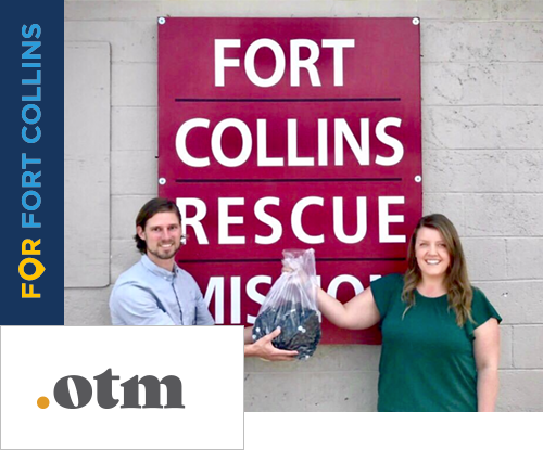 Old Town Media Account Manager passing off a donation of hand sanitizers to the fort collins rescue mission with OTM logo in left corner
