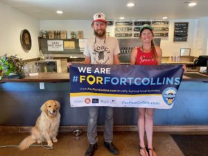 Stodgy Brewing Owners with For Fort Collins banner