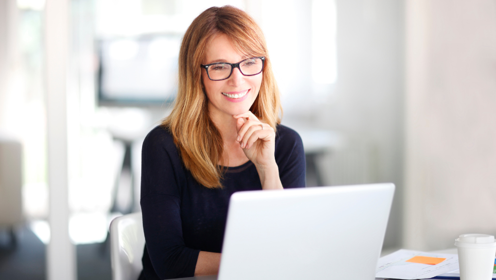 woman on laptop smiling